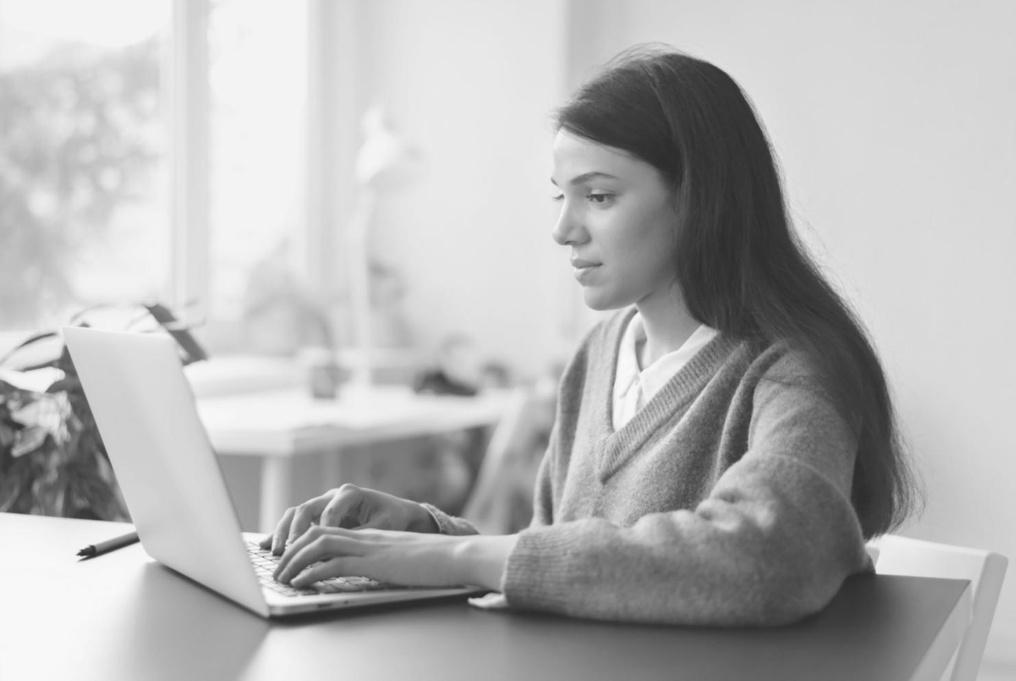 Consultant presenting financial metrics dashboard to client team in conference room